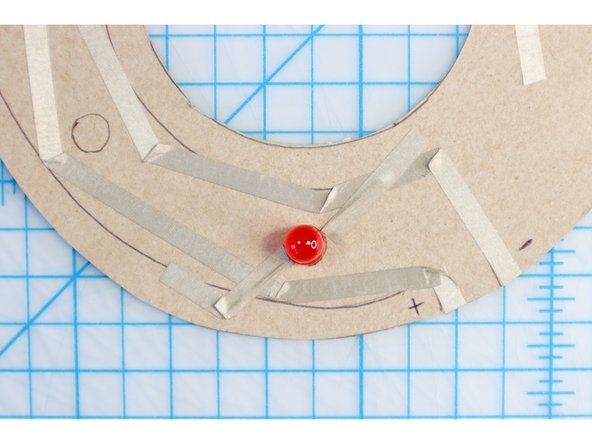 Use a few small pieces of Maker Tape to secure the LED legs in place.