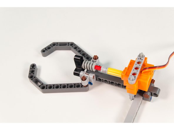 You may need to rotate the shaft to get it to line up with the axle end of the pin. Just grab the axle connector and spin it until the axle is aligned.