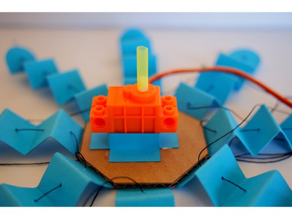 Put the straw onto the servo shaft