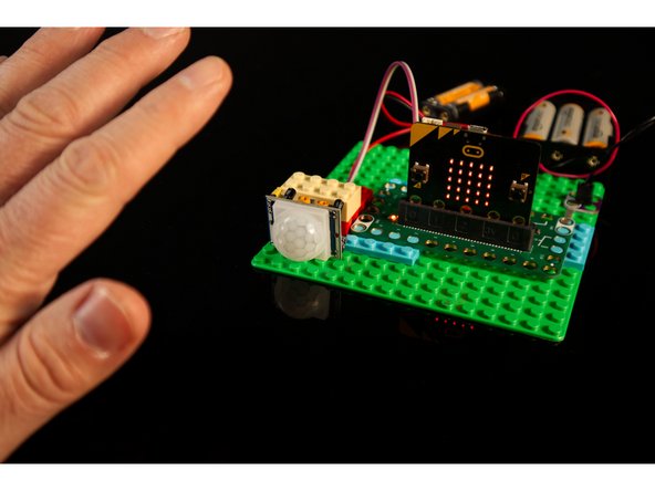 Time to test it out! If possible, leave the room, and then as you enter the room and walk into the view of the sensor it should detect you and change from one LED lit to showing all of the LEDs lit.