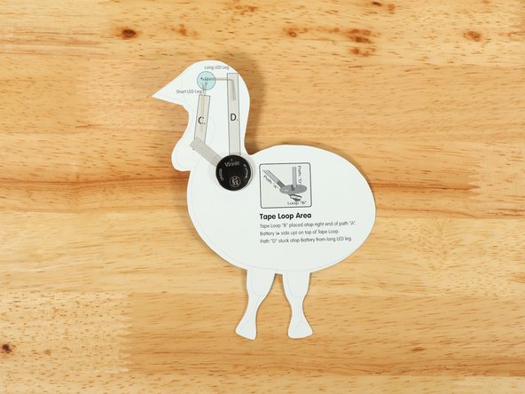 Make sure the Positive side of the Battery is facing upwards, with the Negative side stuck down to the tape.