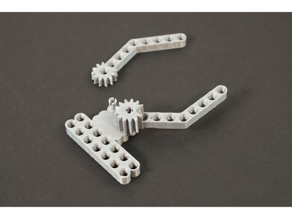 For the finger with the taller gear we'll use the LEGO Axle to Pin Connector (3749 / 6562). The taller gear piece allow for the servo to connect to it.