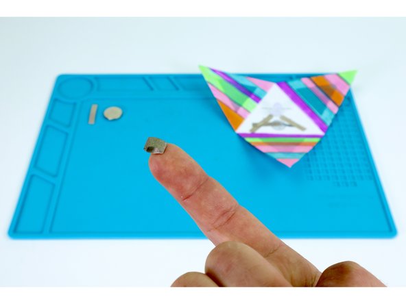 Use one of your two remaining Maker Tape sections to make a tape loop as shown.