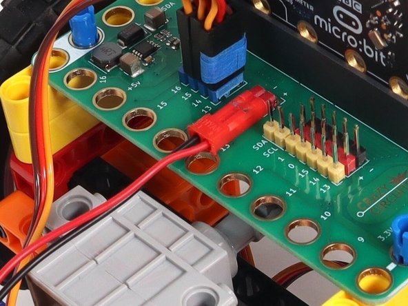 The last connection is the battery pack. It connects to the Bit Board as shown to provide power to the micro:bit and the servos so your rover can move.