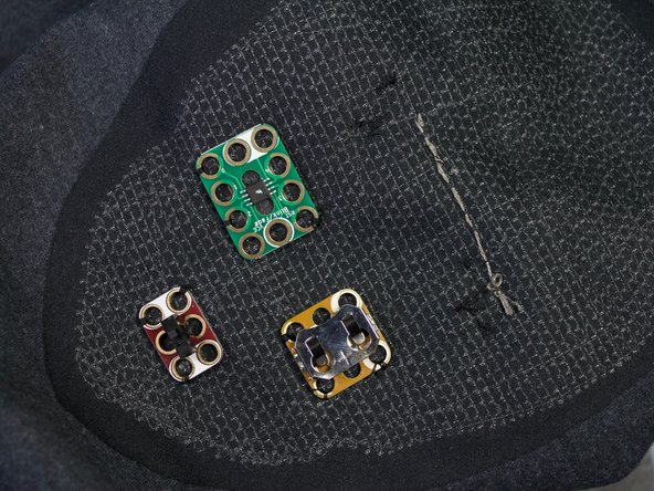 Turn the shirt inside out. Stitch the thread back along the path. Tie a knot and trim the thread as shown.