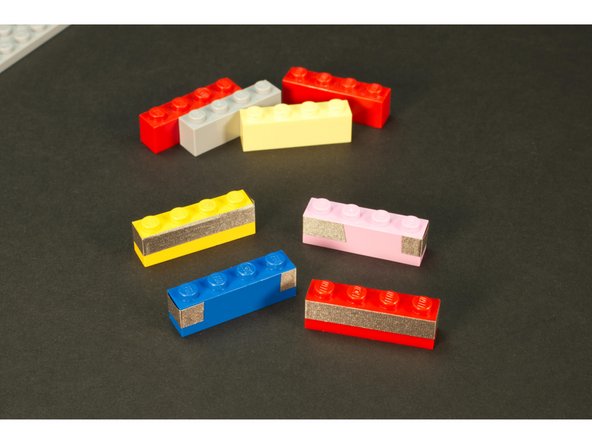 Take four of the bricks and wrap them each with 1/4” Maker Tape.