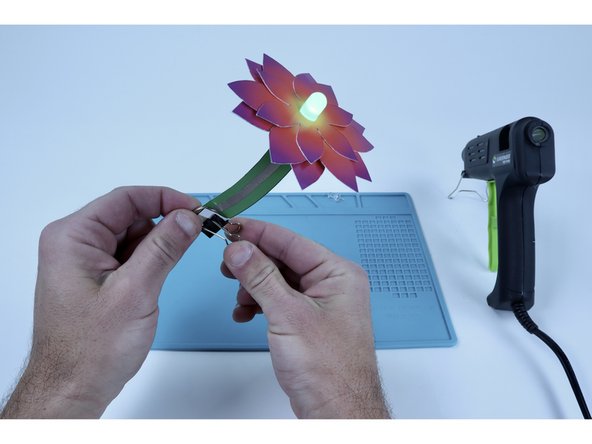 Use your binder clip to clip around the entire battery portion of your project .This will hold the connection firmly in place.