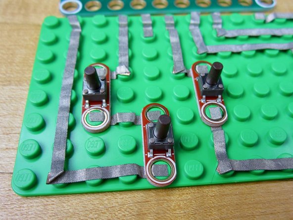 When finished, put your buttons on the board.