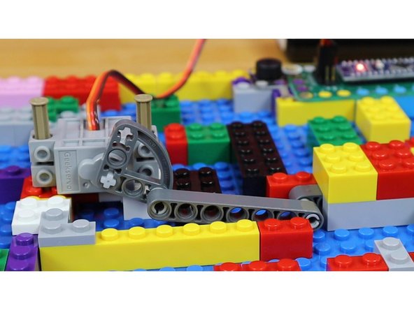 Test the gate by moving the ball bearing onto the two pieces of Maker Tape.