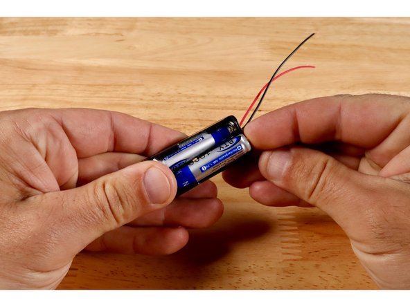 Real ROVs use bigger batteries like the one pictured on your poster. The red and black circles on that 12V Battery graphic are where Positive and Negative wires from your AAA battery packs will be connected instead.