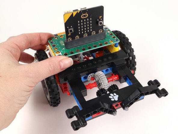 Add the Bit Board on top of the blue pins we added in Step 57.