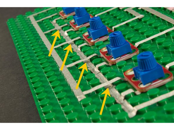 Where the tape might need to cross over another piece of tape, you’ll need to run it in the gutter between the studs so it doesn’t connect to the tape running on top of the studs.