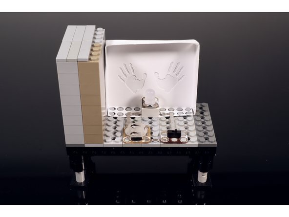 Build the two side walls of the TV and add a top and an antenna. You can always use the same parts that are shown but you can also improvise a different build if you don't have these same LEGOS.