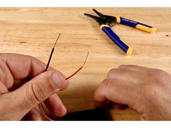 Finish preparing your battery pack by inserting 2X AAA NON-RECHARGEABLE batteries into the battery pack; making sure that they are each facing the correct way.