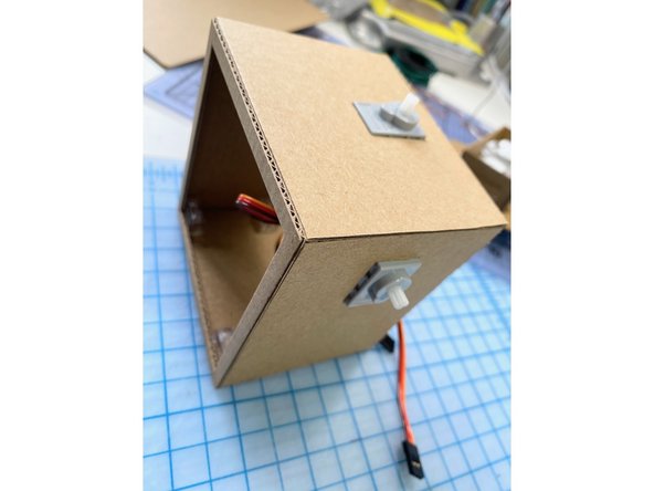 To create the moving eyes, we added another servo to the top of the robot's body.