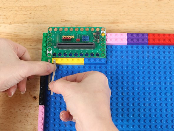 Stick Maker Tape on to LEGO baseplate with the ends going to Pin 0 and the GND Pin  right next to it.