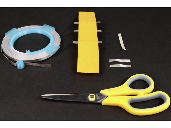 Now you should have three pieces of Maker Tape ready to stick into place: 2 matching small ones and 1 longer.