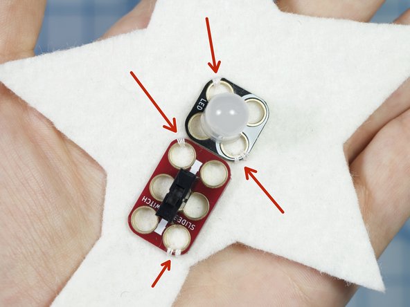 Use a needle and thread to tack the crazy circuits components in place as shown.