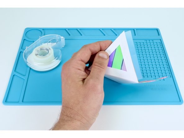 Using tape segments that are the same length as each seam; Lay half of each piece's width on one frame. Bring the neighboring side up to match the edges. Press the remaining part of the tape's width to that next frame.