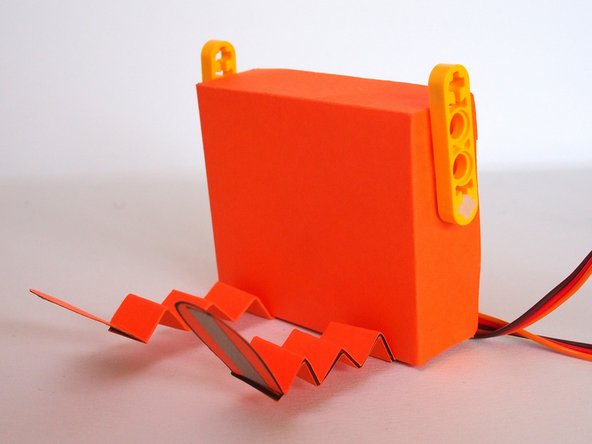 The tabs should stick out the back.