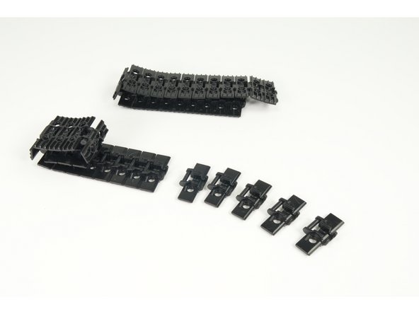 Snap together the track pieces to make two lengths of track, each containing 21 pieces.