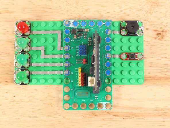 In order to fit all of the components onto one baseplate, all paths leading to Ground (GND) wrap around the edge and run along the bottom side of the baseplate.