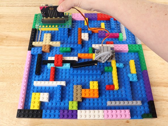 We're going to load the following code for our LEGO Maze program: https://makecode.microbit.org/_bp20qxUvL...