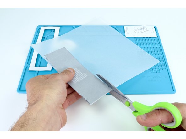Find your sheet of velum, tracing paper or copy paper and use the gray rectangle to help you cut the same shape with a scissors as shown.