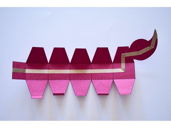 Prefold the creases on the tail.