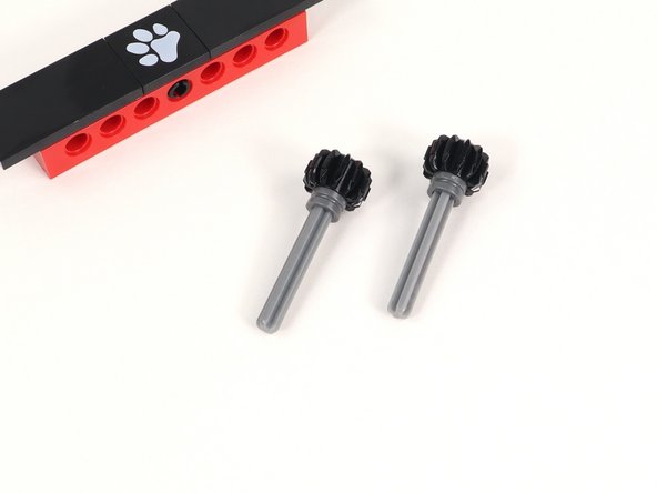 Add a half bushing to each axle and push it all the way down to the gear.