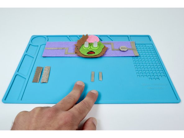 Cut two small pieces of Maker Tape that you will use to create tape loops. These tape loops are involved in the conductive  hook and loop closure system.