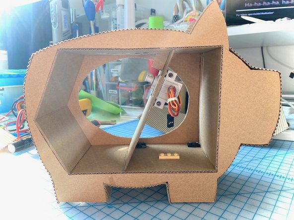 Here are some photos of the front and back of the pig once everything was glued in place. It's looking pretty good! :)