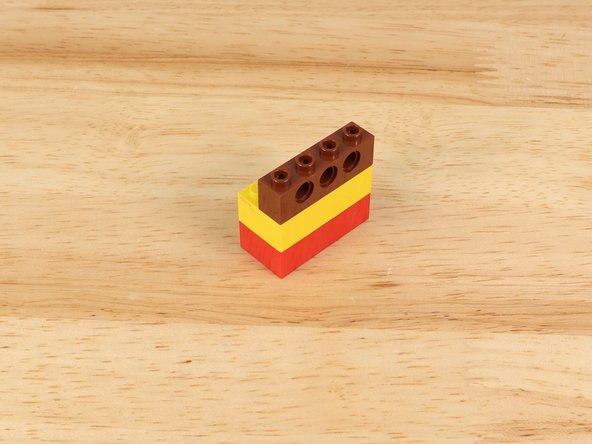 Grab two standard LEGO bricks and another LEGO Technic Brick 1 x 4 with Holes (3701).