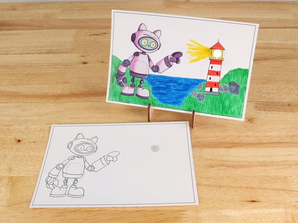 Poke holes through the front of the card for the LED legs, then push the legs through the front.