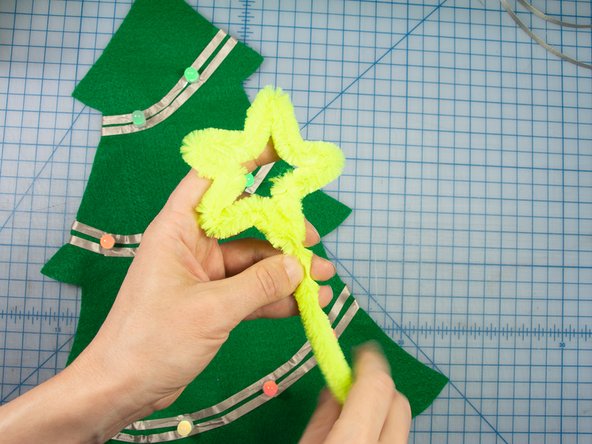Make a star from a large yellow pipe cleaner.