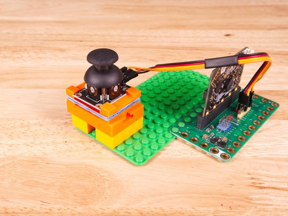 We attached two 2x4 LEGO Bricks to the bottom of the 3D printed holder to allow it to snap onto the LEGO Baseplate a bit easier.