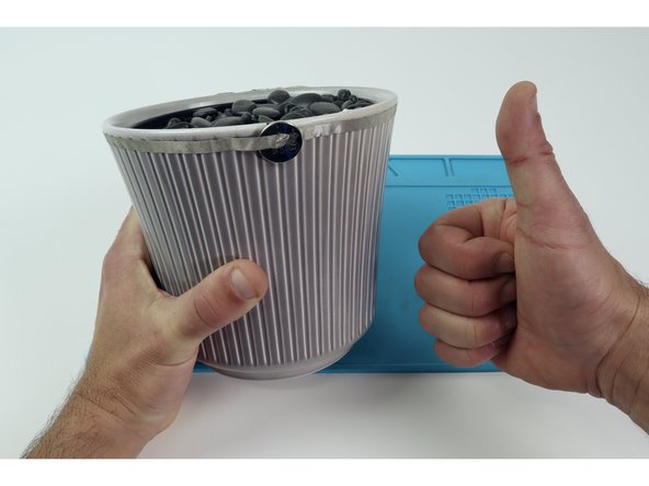 Now cut and connect another long Maker Tape path to the backside/positive path on the Molded LED array and run IT around the opposite side of the flower pot, eventually connecting it to the positive side of the battery.