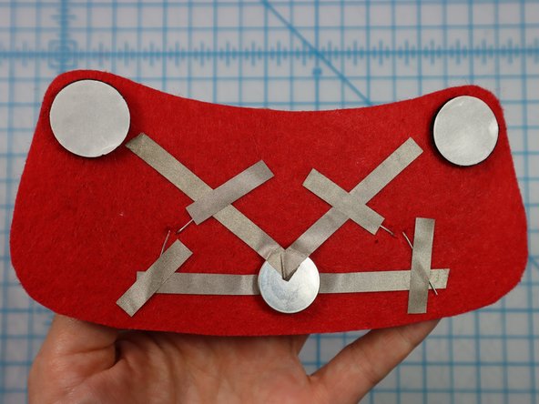 Peel the paper backing off of each hook and loop dot and place it where shown on the template.