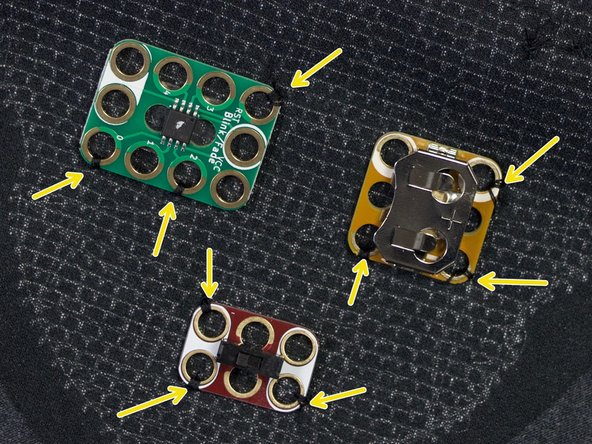 Tack the other components to the shirt where shown, through at least three of the holes.