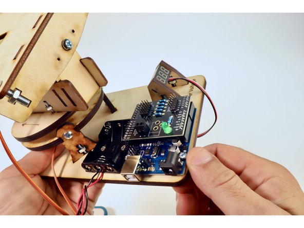 Take care to line up all the pins from the underside of the Arduino shield  with the holes on the Arduino.