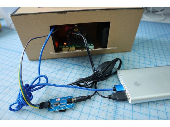 Plug in the two USB cables (one connected to the micro:bit and the other connected to the speakers) into a USB battery pack to make the project portable.