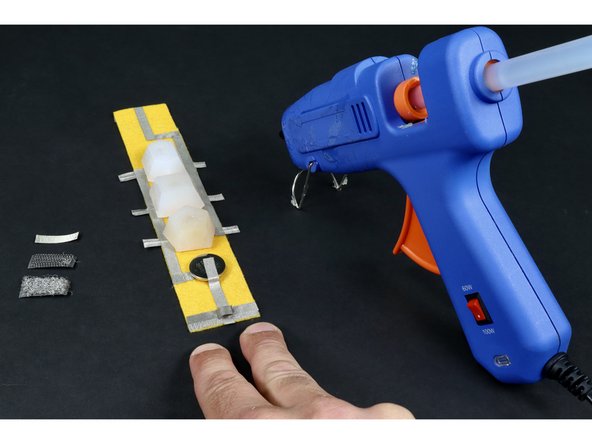 Place that tape loop where shown in photos 2 and 3. 