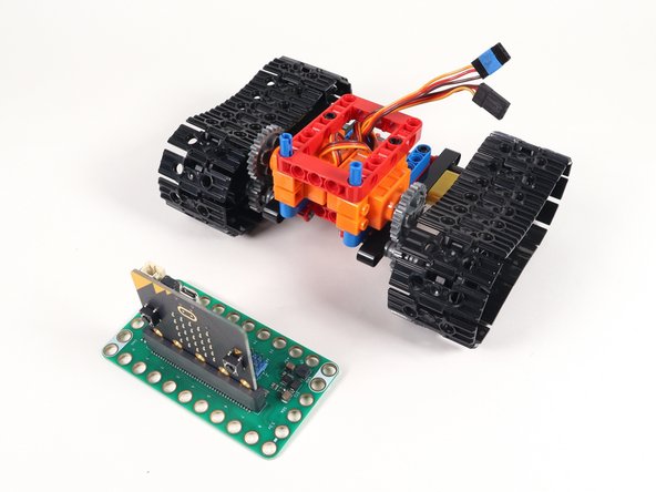 The Bit Board fits onto the two long pins sticking out of the top of the frame.