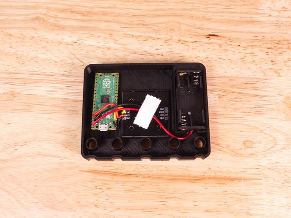 Make sure to route the wires as shown. As with the microcontroller, you may need to make adjustments to the wires for the back cover to fit.