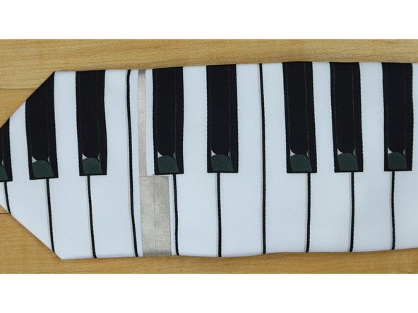 Use two short pieces of 1/4th inch Maker Tape, making sure that each piece slightly overlaps the others.