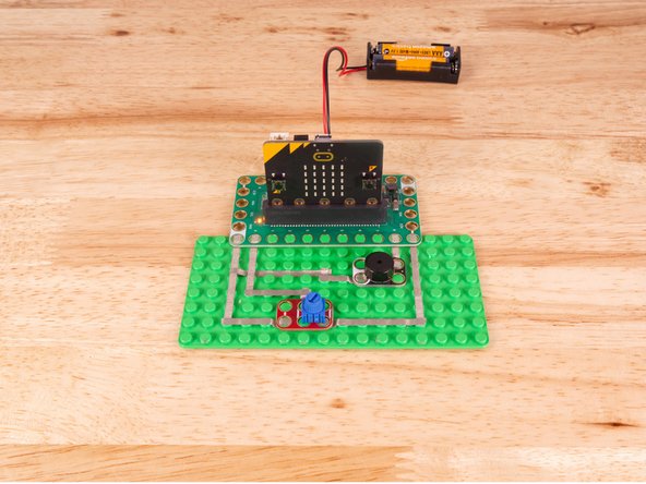 The Piezo will connect to Pin 8 and to Ground (GND) BUT! We're going to use the &quot;gutter&quot; between the LEGO baseplate studs so we can have two layers of tape that do not touch.