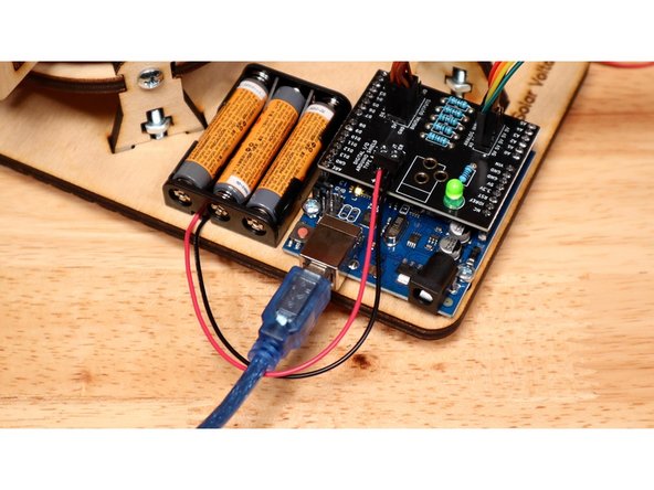 Note:  You must power the Arduino via USB and power the shield with the 3 AAA Battery Pack with fresh batteries.