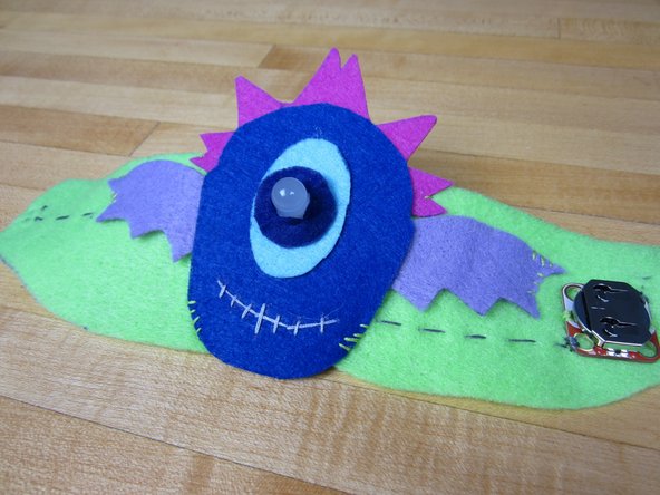 Use the Flying Eye template to create your bracelet topper and use it for steps 23 and 24 in the printable instructions.