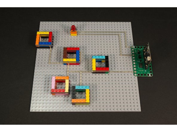 When the tweezers touch the Maker Tape, the circuit is completed and the micro:bit will play a sound and light up the nose.