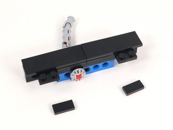 Add (2) 1x2 tiles to the remaining exposed studs on Section 1.